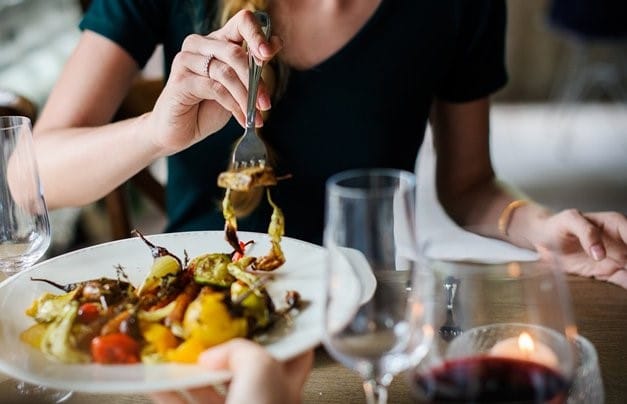 Woman trying Italian Antipasti