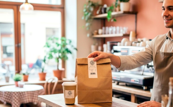 Sticky receipt paper used for foodservice order labeling and takeout packaging