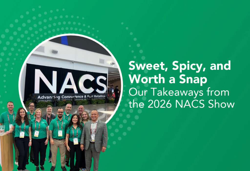 NCCO team attending the 2026 NACS Show in Las Vegas, standing in front of the NACS event sign.